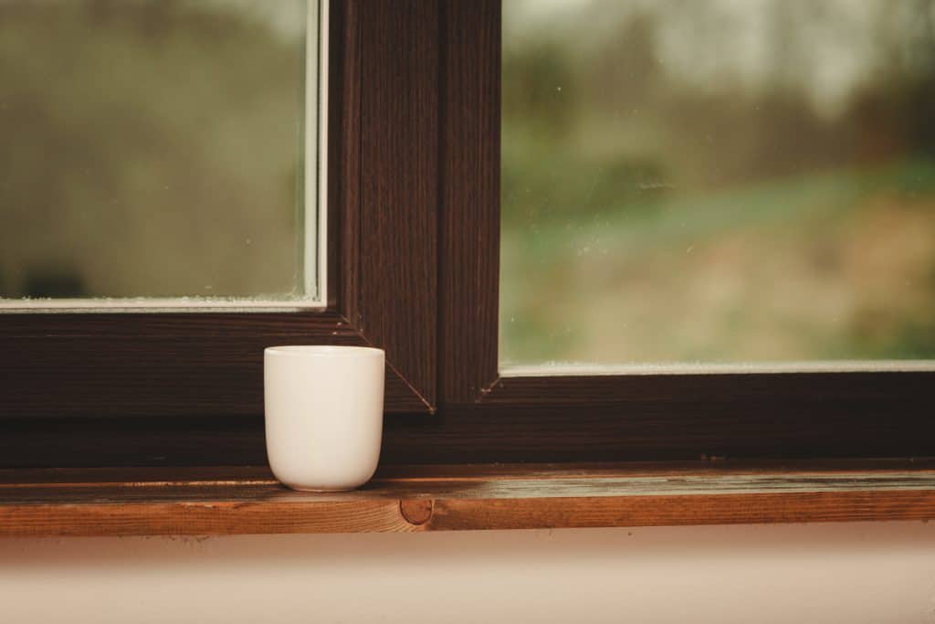 Coffee mug on top of a window sill