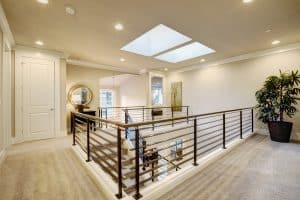 Second floor landing features skylight over the stairs